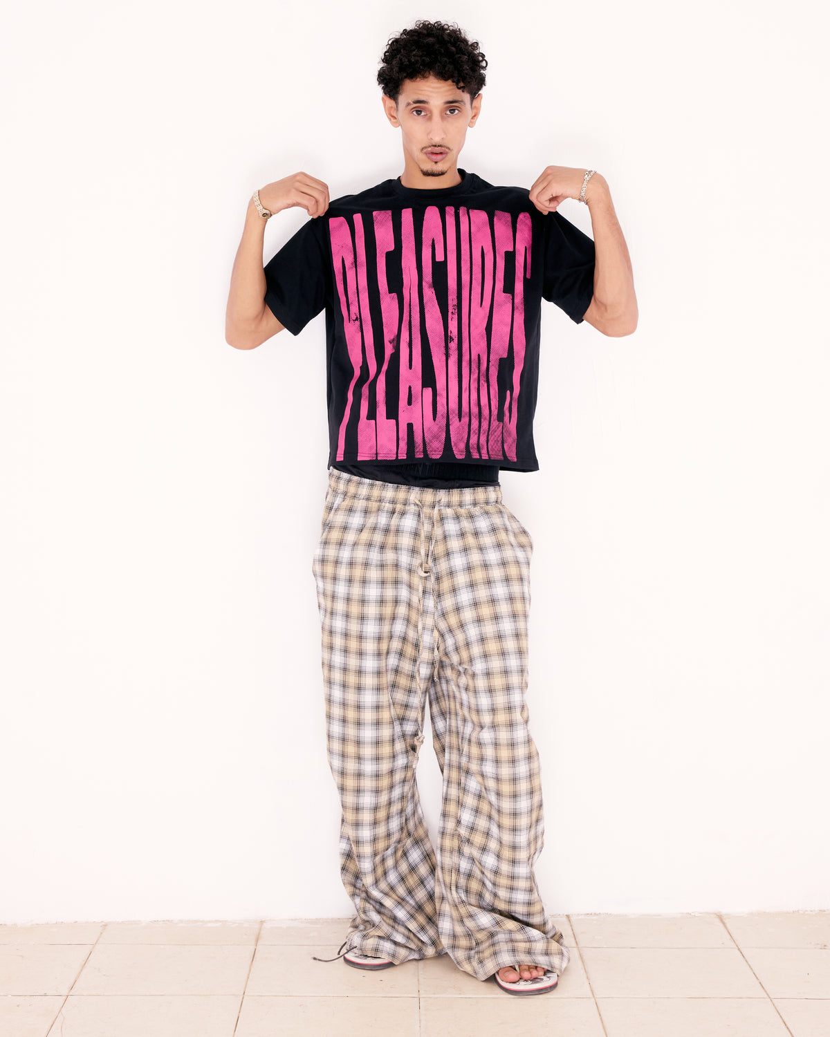 PLEASURES TEE