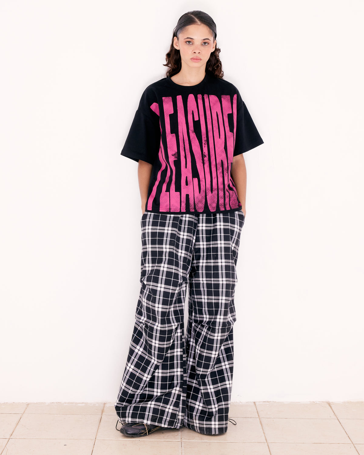 PLEASURES TEE